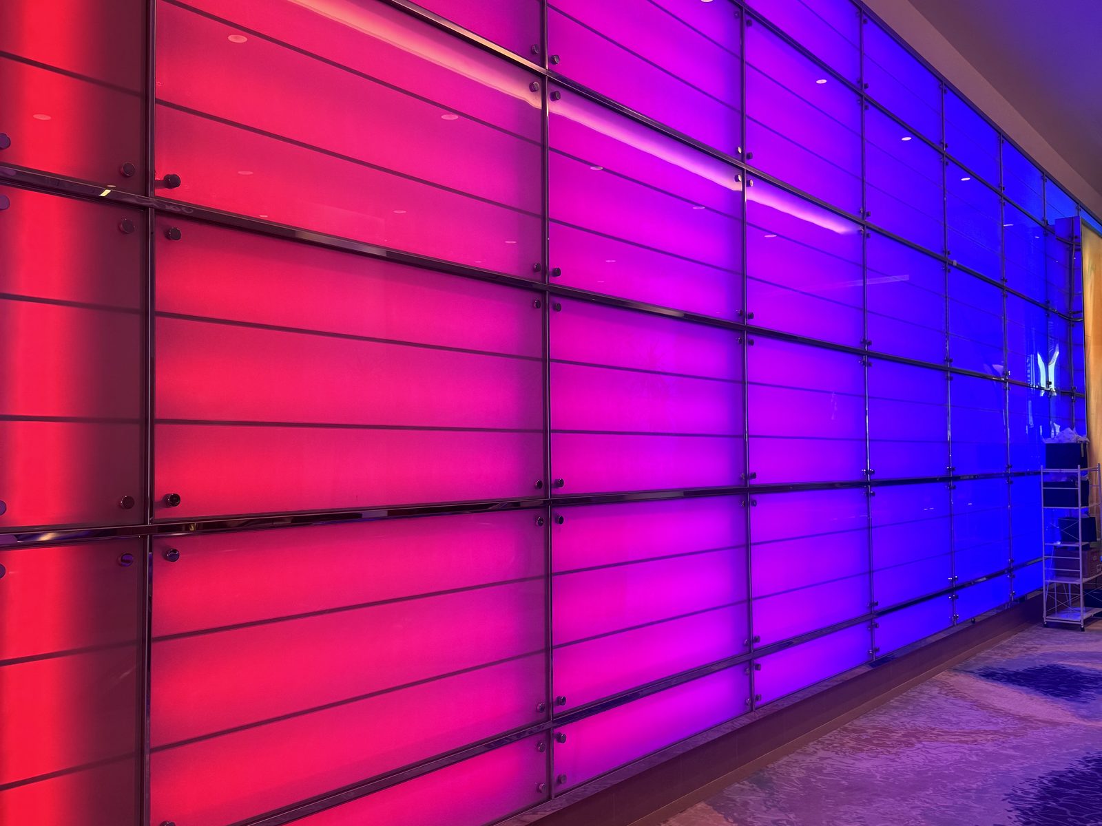 Color-changing lobby feature wall at the Hilton San Diego Bayfront in red, magenta and blue